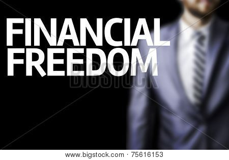 Financial Freedom written on a board with a business man on background
