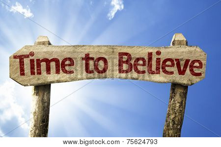 Time to Believe wooden sign on a beautiful day