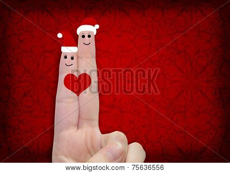Concept or conceptual old vintage red pattern paper background with man and woman finger in love with Christmas hats and a heart painted, metaphor to family, couple, celebration, holiday, roamnce card