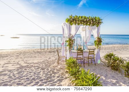 wedding arch and set up on beach, tropical outdoor wedding cabana on beach, wedding table for dinner