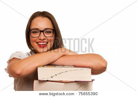 Happy Asian Caucasian Girl Lerning In Study Woth Lots Of Books On The Table