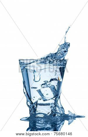 water splash in glass isolated on white