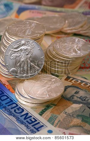 International currency and walking libery silver