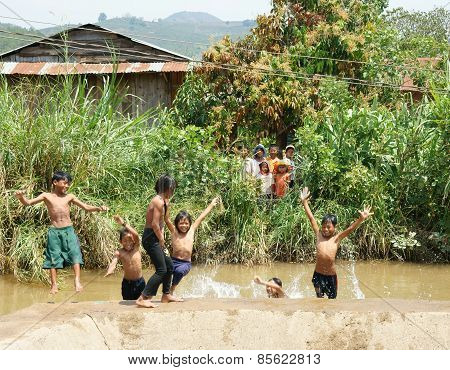 Asian Children Bath In The River