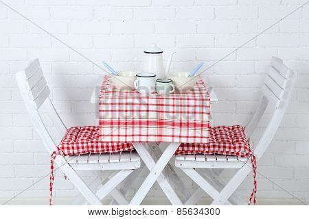 Wooden chairs and table in cozy kitchen