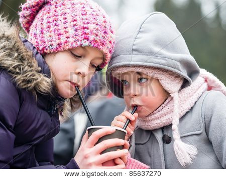 Little Girls Drinking Water Outdoors