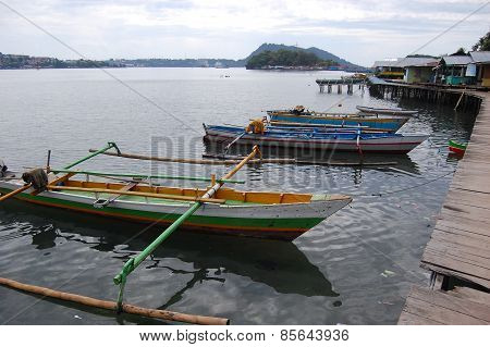 Traditional Fishing Boats At Timber Pier Indonesia