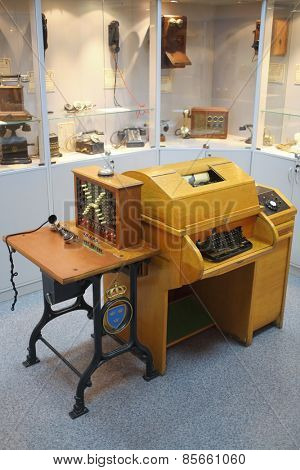 MOSCOW - APR 05, 2014: Transceiving telegraph with the keyboard, when receiving a message is automatically recorded letters and commutator in the Museum of the History telephone in Moscow