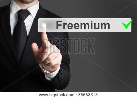 Businessman Pushing Flat Button Freemium
