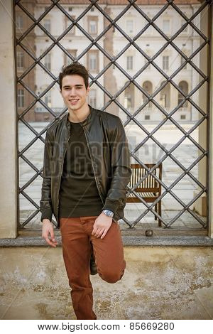 Handsome Young Man Outside Historical Building In European City