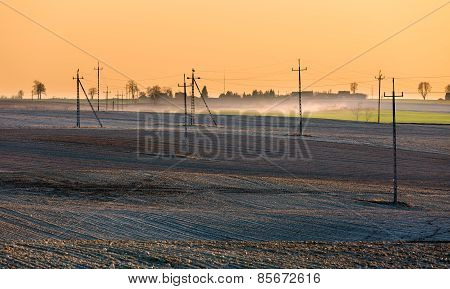Plowed Field With Power Poles