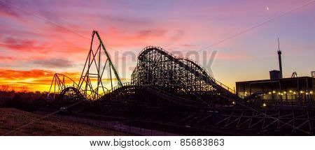 Curves Of A Roller Coaster At Sunset Or Sunrise