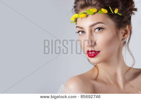 beautiful young sexy elegant woman with red lips, beautiful hair with a wreath of yellow roses