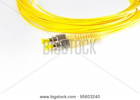 Close up of a fiber optic patchcord on white background