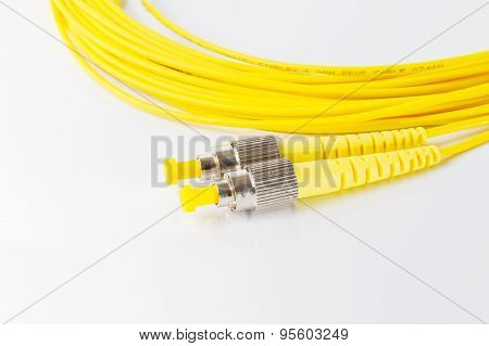 Close up of a fiber optic patchcord on white background