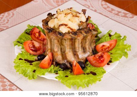 Crown Roast Of Pork Ribs With Cauliflower And Vegetables