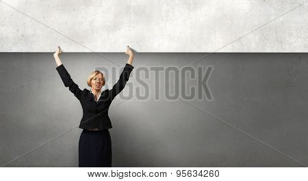 Yoiung pretty woman holding blank banner with place for text