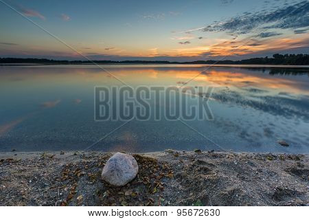 Beautiful Lake At Sunset Landscape With Cloudy Sky Reflecting In Water
