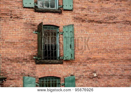 Brick wall with iron shutters