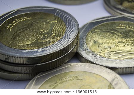 500 Colombian pesos coins. Macro of coins composition.