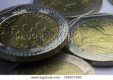 500 Colombian pesos coins. Macro of coins composition.