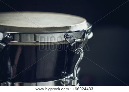 Goblet drum or darbuka percussion musical instrument on dark background