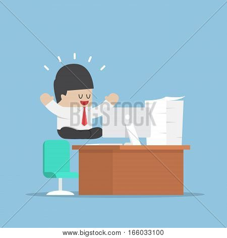 Businessman Meditating In Lotus Position Over His Desk