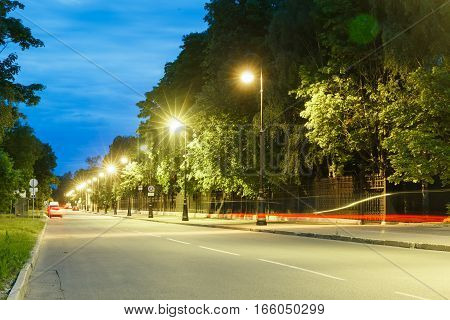 Wrought iron fence of the Letny Garden in Kronstadt at night