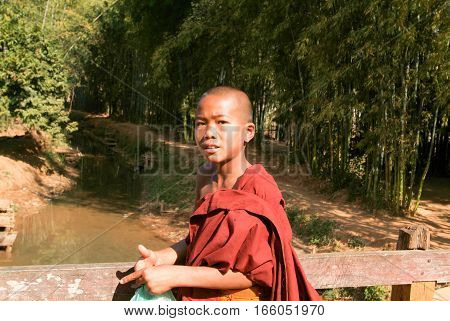 Indein Myanmar - 15 January 2010: Young monk at the weekly market at Indein on Inle Lake in Myanmar