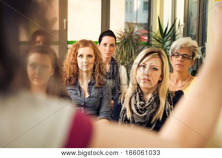a group of women are attending a lecture