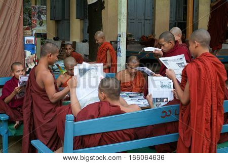 MANDALAY MYANMARMAY - 19 January 2010: Monks reading newsparers at the Shwe in Bin Kyaung monastery of Mandaley on Myanmar