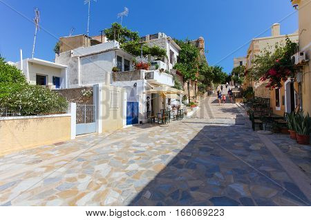 Rethymnon Island Crete Greece - June 23 2016: The narrow street of Rethymnon (part of Old Town) where there are a lot of small cafes and shops
