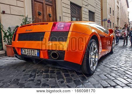 Rome, October 23, 2010: A Lamborghini is parked on a cobblestone street.