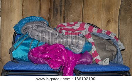 a pile of clothes and a chair