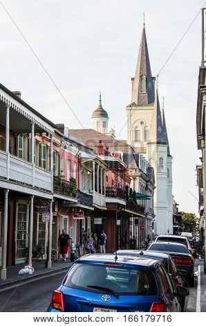 New Orleans, USA - July 8, 2015: St Louis Cathedral with old town buildings and street