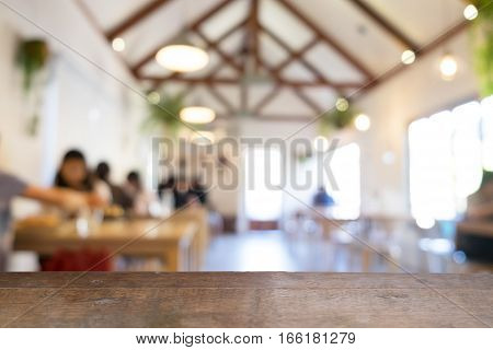 product display montage of Empty wooden table and blurred resturant or coffee shop background