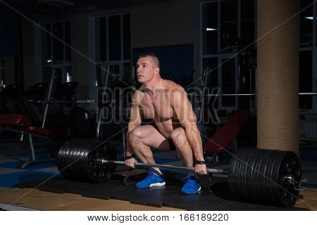 Sports background. athlete getting ready for weight lifting training.