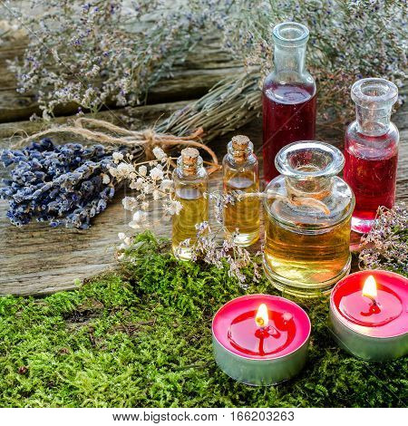 Bunch Of Dry Lavender, Candles And Bottles Of Scented Oil.