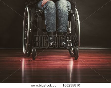 Disease disability paralysis handicap health concept. Legs of disabled person. Crippled female sitting on wheelchair.
