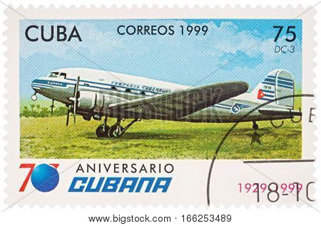 MOSCOW RUSSIA - January 17 2017: A stamp printed in Cuba shows passenger aircraft Douglas DC-3 series 