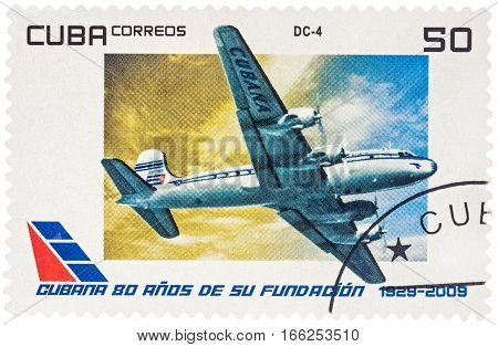 MOSCOW RUSSIA - January 18 2017: A stamp printed in Cuba shows passenger aircraft Douglas DC-4 series 