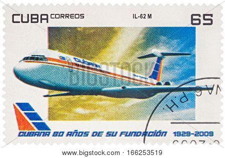 MOSCOW RUSSIA - January 18 2017: A stamp printed in Cuba shows passenger airliner Ilyushin IL-62M series "The 80th Anniversary of the Cuban aviation 1929-2009" circa 2009