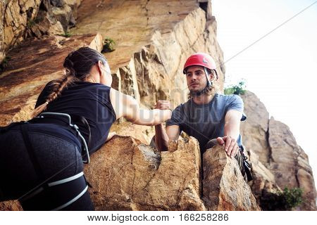 Young climbers rock climbing in old quarry