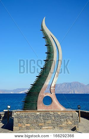 AGIOS NIKOLAOS, CRETE - SEPTEMBER 17, 2016 - Cornucopia statue also known as the Horn of Amalthea at the waters edge Agios Nikolaos Crete Greece Europe, September 17, 2016.
