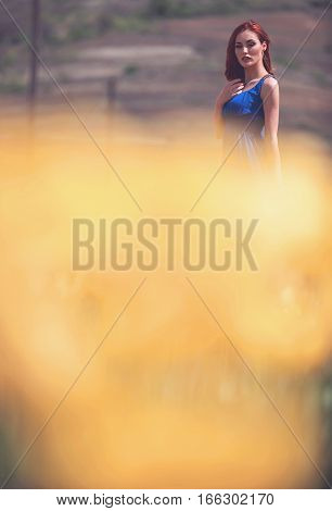 Woman In Tulips Field