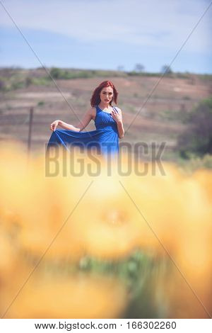 Woman In Yellow Flower Field