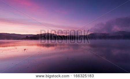 Fog over Lake Solina at dawn, Bieszczady Mountains, Poland