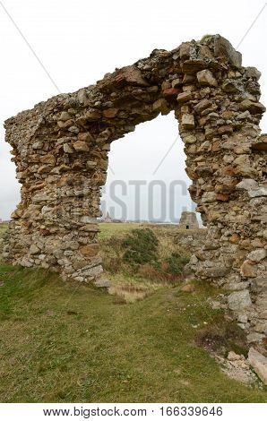 A partially collapsed wall at a ruined building near Elie