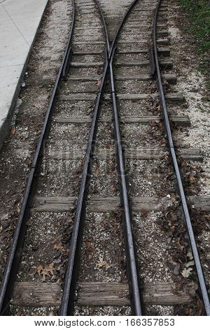 Old narrow railways going to perspective . Vertical.