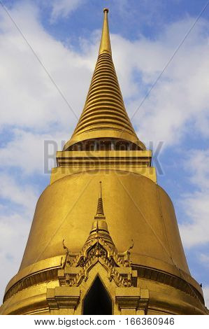 view of famous religion temple wat phra prakaew grand palace in Bangkok Thailand under a blue sky in travel and tourist destination landmark in Asia